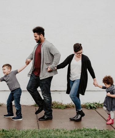 Hero image: a family holding hands